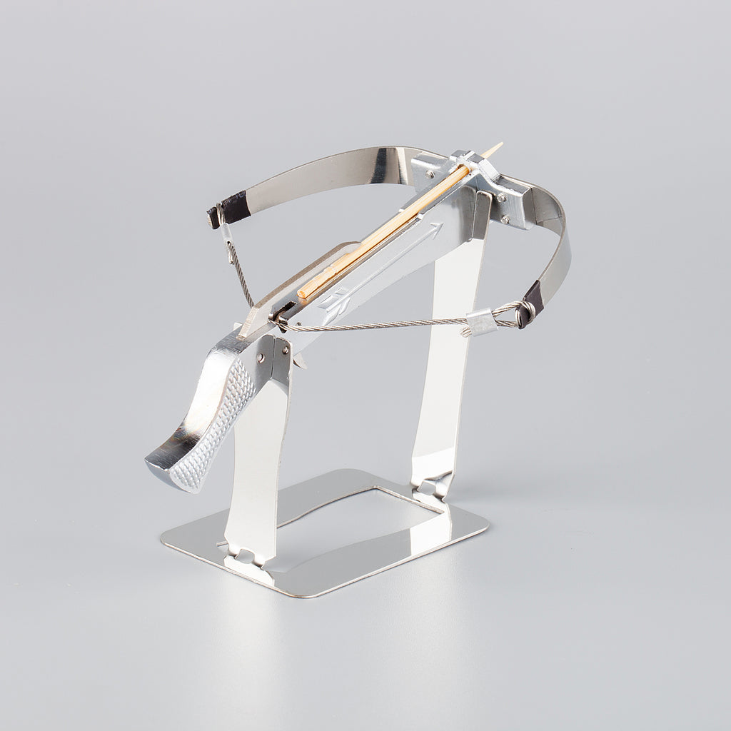 silver bowman crossbow on a stainless steel display 
