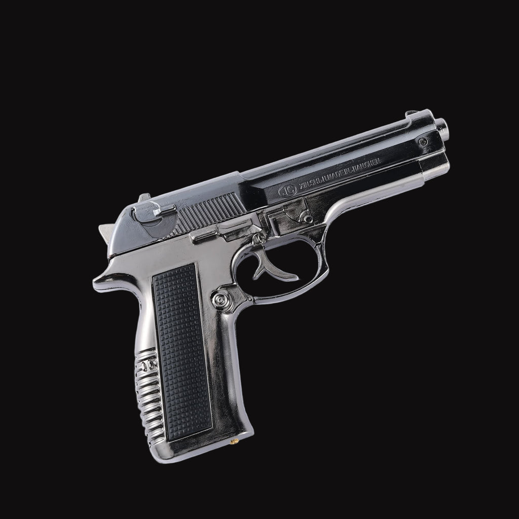 Silver revolver lighter on a black background