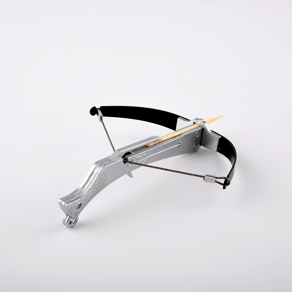 Mini silver bowman crossbow loaded with toothpick