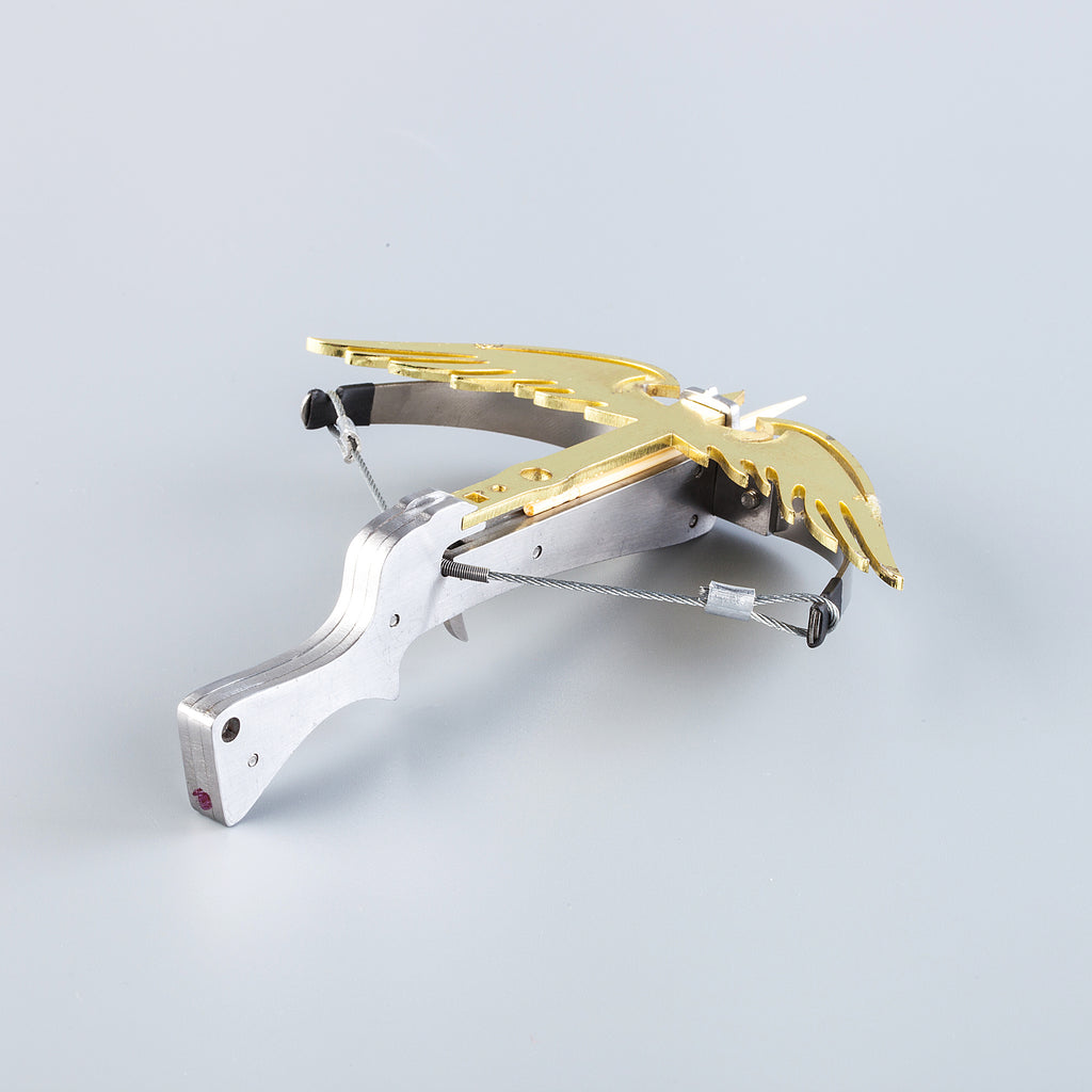 mini steel phoenix crossbow loaded with toothpick