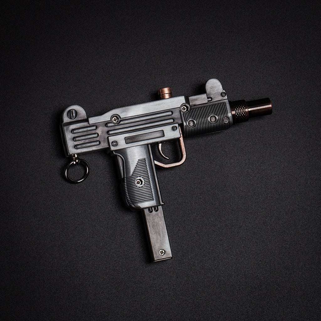 silver and copper Tommy 709 butane torch gun lighter