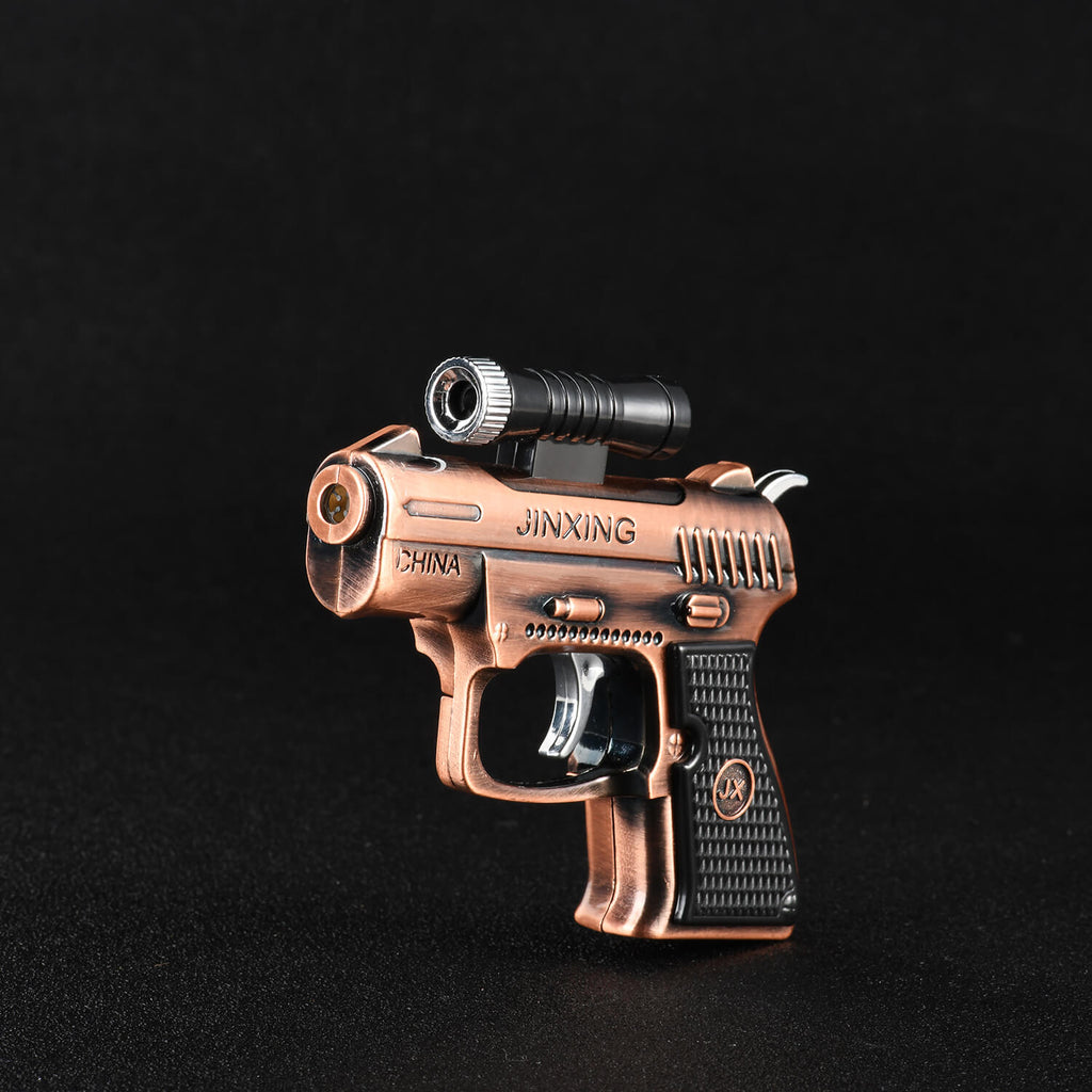 Jinx mini copper plated butane gun lighter and laser pointer scope on display