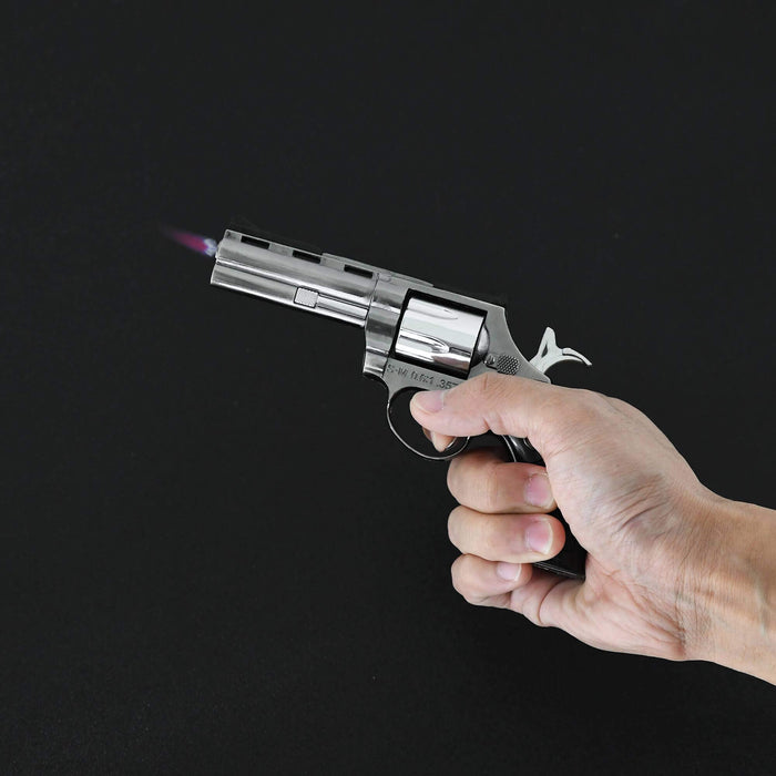 Hand holding a .357 MAG butane lighter 