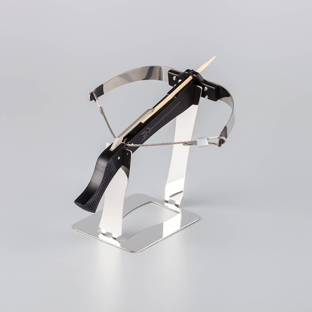 Black bowman crossbow on a stainless steel display stand